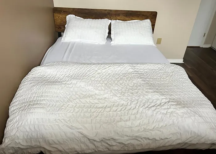 Warm Minimalist Bedroom + Free Parking