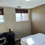 Warm Minimalist Bedroom + Free Parking